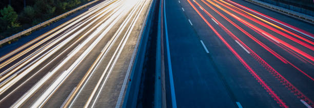 istock light trace from busy night traffic on the highway 854529060