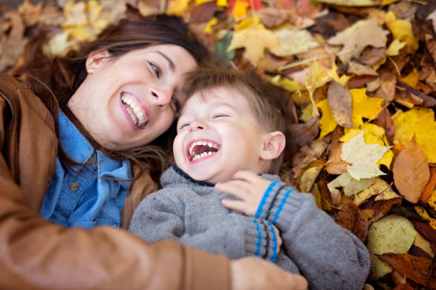 istock Mother with son in forest in autumn 854529074