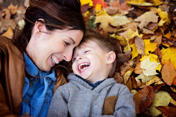 istock Mother with son in forest in autumn 854529188