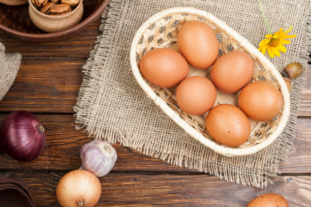 istock chicken eggs in basket decorated with food ingredients on wooden table 854529224