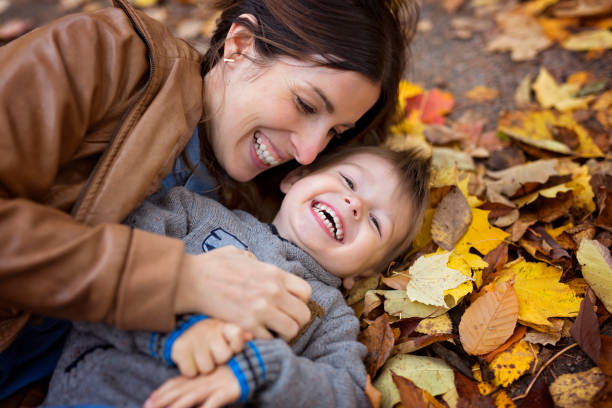 istock Mother with son in forest in autumn 854529332