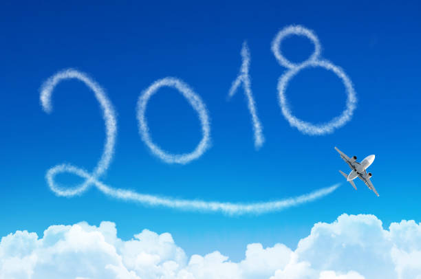 istock Happy New year 2018 drawing by airplane in the sky clouds. 854529896