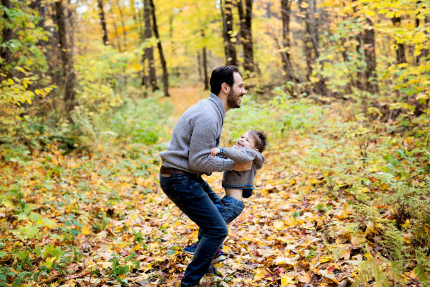 istock nature with dad in forest autumn 854530474