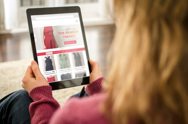 istock Woman looking at a web page on a tablet computer indoors 854533686