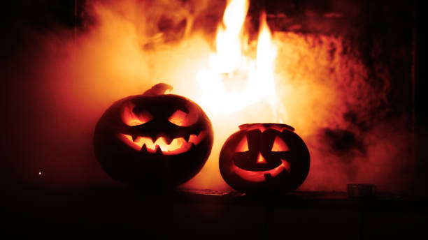 istock Creepy halloween pumpkins near a fireplace. 854539950