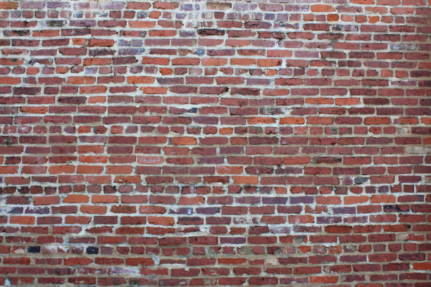 istock Wall of old red brick and mortar 854545108