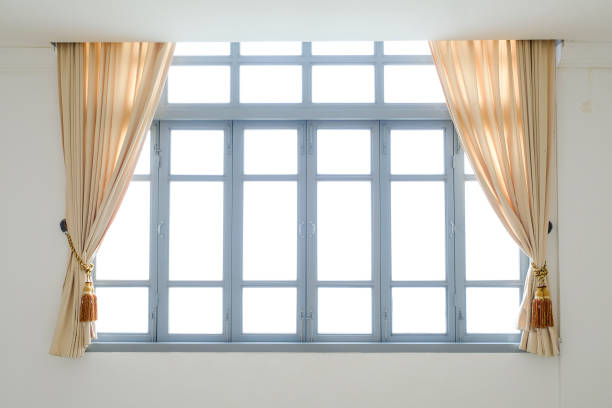 istock Beige curtains in a classic style. Interior 854550588