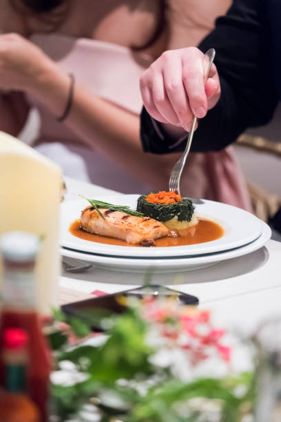 istock Cropped image of man eating in restaurant 854551120