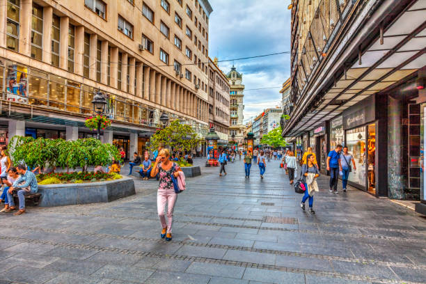 near the palace Serbia, Belgrade – September 19: Knez Mihajlova Street on September 19, 2017 in Belgrade. Building of the palace of Albania, lots of shops and people, HDR Image. knez mihailova stock pictures, royalty-free photos & images