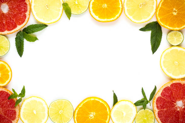 istock frame with slice of oranges, lemons, limes, grapefruit and mint pattern on white. Flat lay 854566424