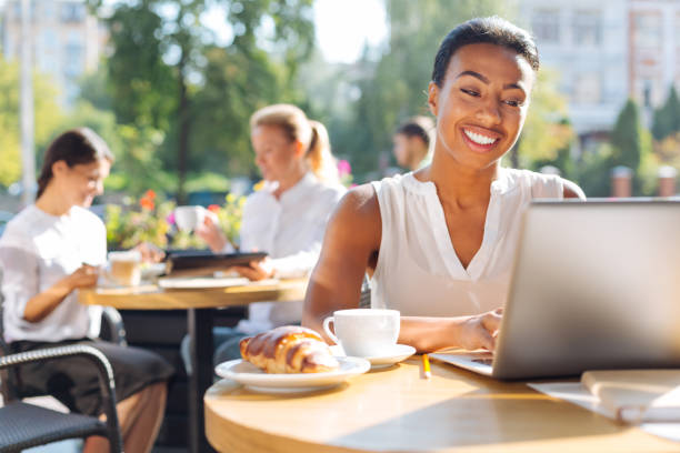 istock Happy woman chatting while sitting in cafe 854569890