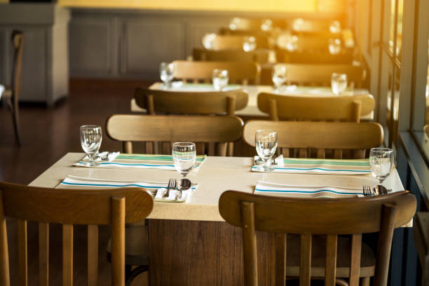 istock Chairs and counters, coffee shop bar, table seat, dining table in the restaurant has a plate of cutlery, a glass of water, and a decorative mat for the table. 854571140