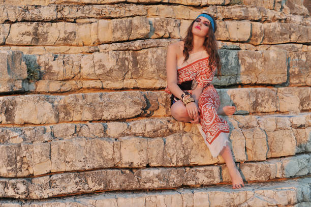 istock Young pretty girl on the rocks 854571858