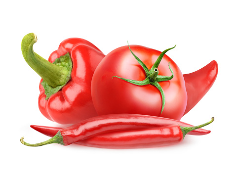 Isolated vegetables. Fresh tomato, bell pepper and red chili peppers isolated on white background with clipping path