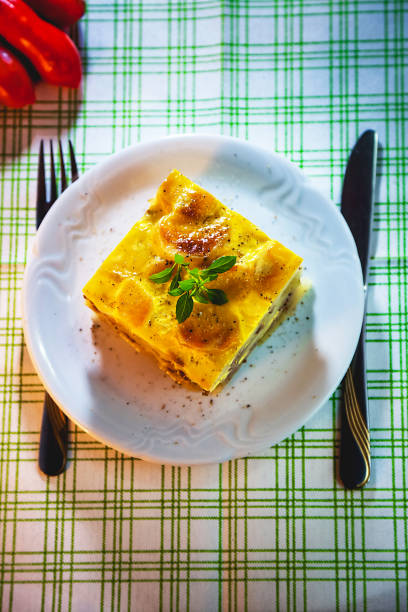 istock Slice of freshly cooked Serbian moussaka meal on white plate 854577340