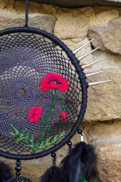 istock Handmade dream catcher with feathers threads and beads rope hanging 854577494