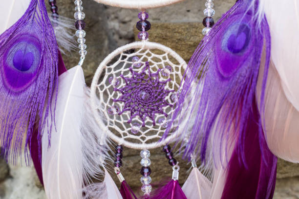 istock Handmade dream catcher with feathers threads and beads rope hanging 854577564