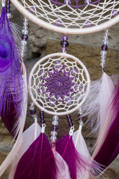 istock Handmade dream catcher with feathers threads and beads rope hanging 854577576