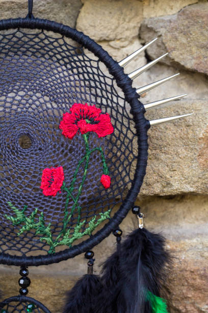 istock Handmade dream catcher with feathers threads and beads rope hanging 854577590