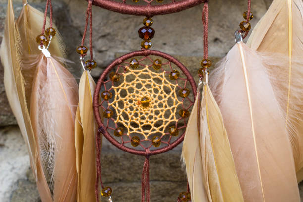 istock Handmade dream catcher with feathers threads and beads rope hanging 854577642