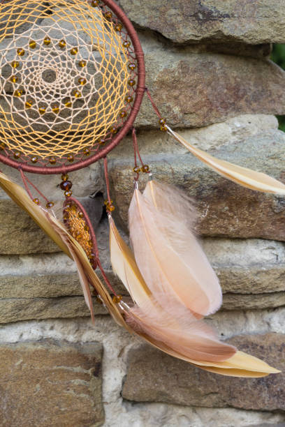 istock Handmade dream catcher with feathers threads and beads rope hanging 854577656
