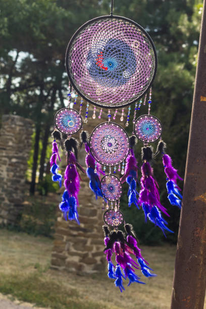 istock Handmade dream catcher with feathers threads and beads rope hanging 854577926