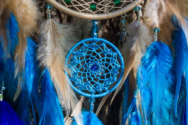 istock Handmade dream catcher with feathers threads and beads rope hanging 854577984