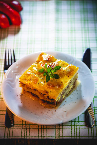 istock Slice of freshly cooked Serbian moussaka meal on white plate 854577992