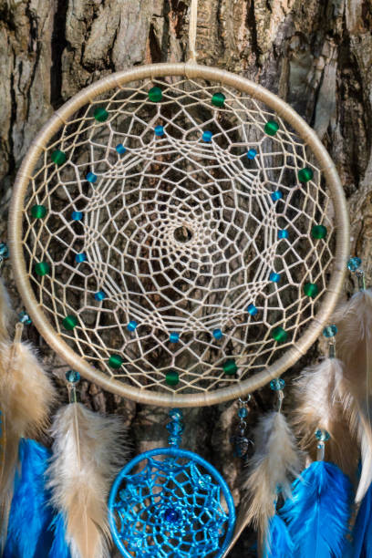 istock Handmade dream catcher with feathers threads and beads rope hanging 854578010