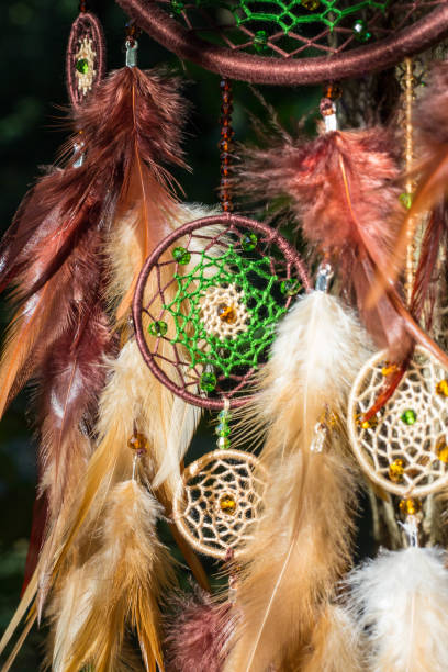 istock Handmade dream catcher with feathers threads and beads rope hanging 854578046