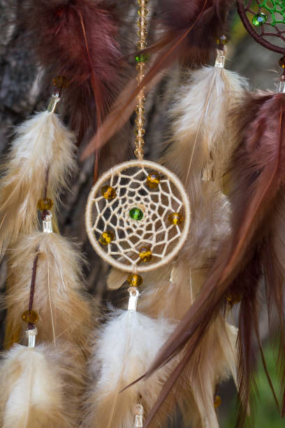 istock Handmade dream catcher with feathers threads and beads rope hanging 854578144