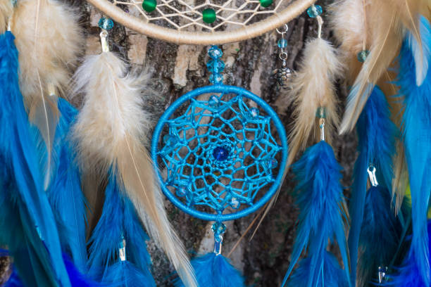 istock Handmade dream catcher with feathers threads and beads rope hanging 854578284