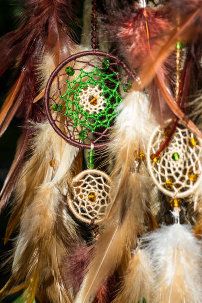 istock Handmade dream catcher with feathers threads and beads rope hanging 854578338