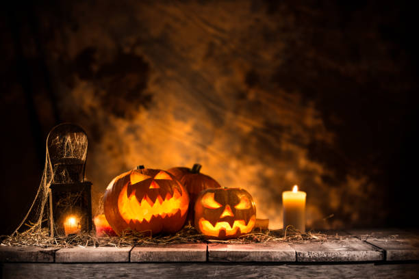 istock Halloween Pumpkins on old wooden table 854578838
