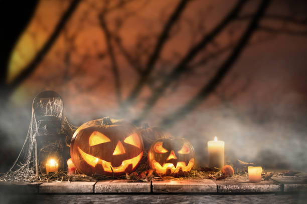 istock Halloween Pumpkins on old wooden table 854579078