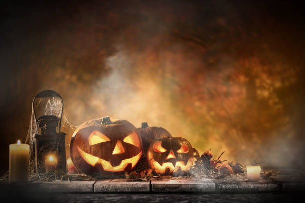 istock Halloween Pumpkins on old wooden table 854579312