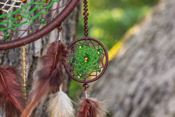 istock Handmade dream catcher with feathers threads and beads rope hanging 854581490