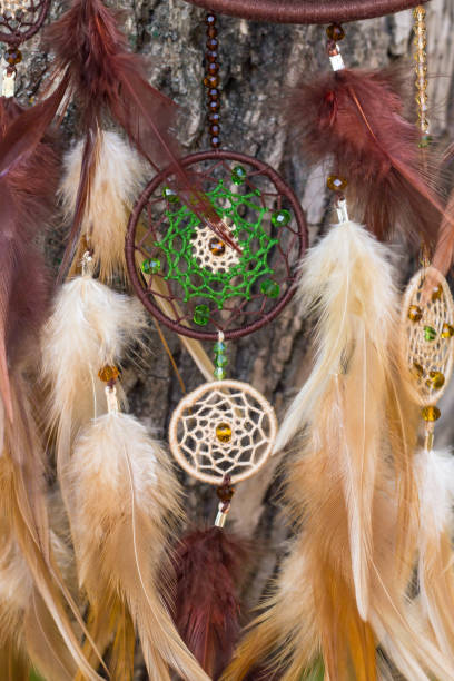 istock Handmade dream catcher with feathers threads and beads rope hanging 854581536
