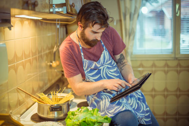 istock Handsome bearded man making healthy meal in the kitchen 854593176