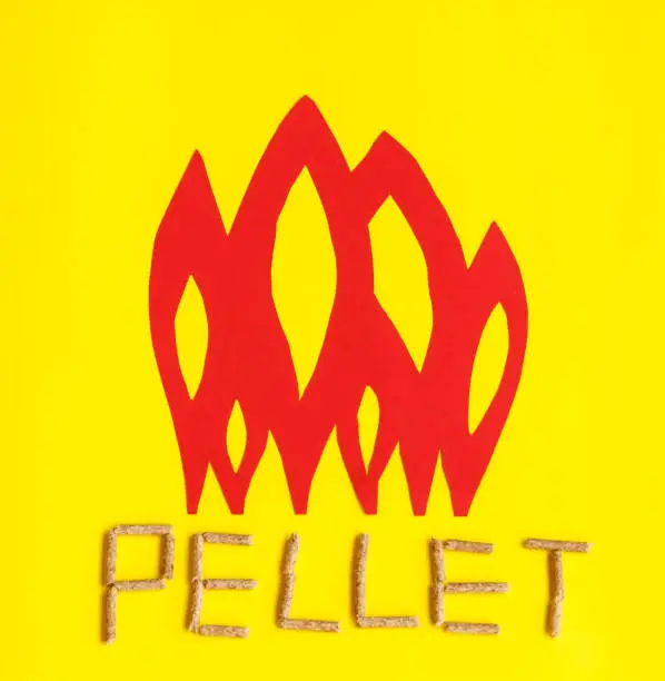 grains of pressed wood are laid at the base of red  flames to create united togheter  form the word pellet