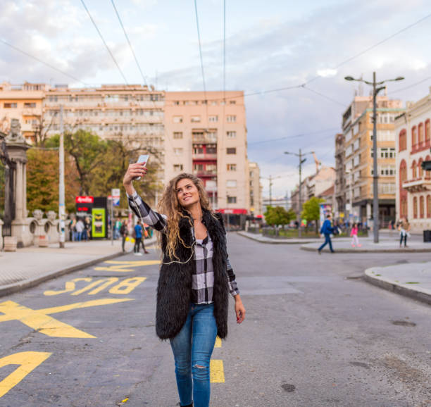 istock Smiling woman taking a selfie photo 854595850