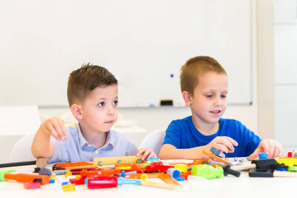 istock two child boy play repair toys 854597912
