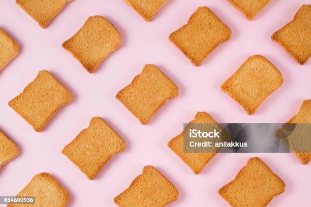 Slice Of Toasted Bread On Pink Background Stock Photo - Download Image Now - Bread, Toasted Bread, Breakfast