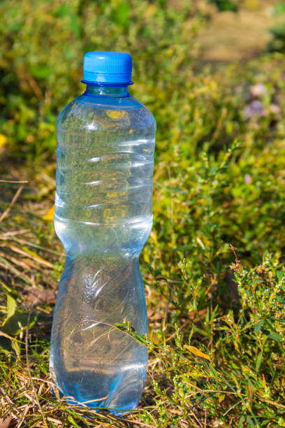istock Plastic bottle of drinking water on the ground 854603052