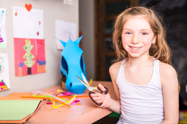 istock Young Girl use his imagination with cardboard 854619358