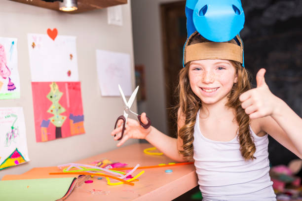 istock Young Girl use his imagination with cardboard 854619480