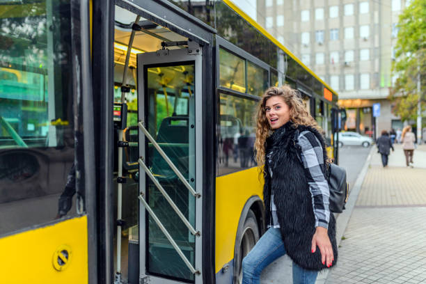 istock Young woman stepping into the bus 854620920