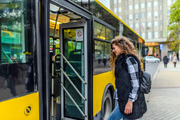 istock Young woman stepping into the bus 854620950