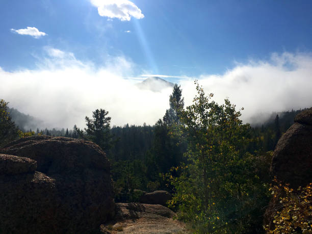 Barr Trail in Colorado with One Mountain Showing Through the Clouds