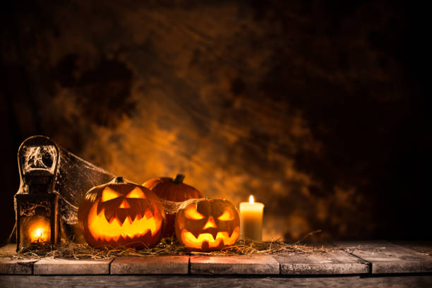 istock Halloween Pumpkins on old wooden table 854642656